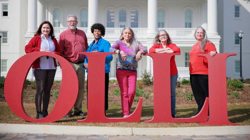 OLLI members standing outside Bryce Main